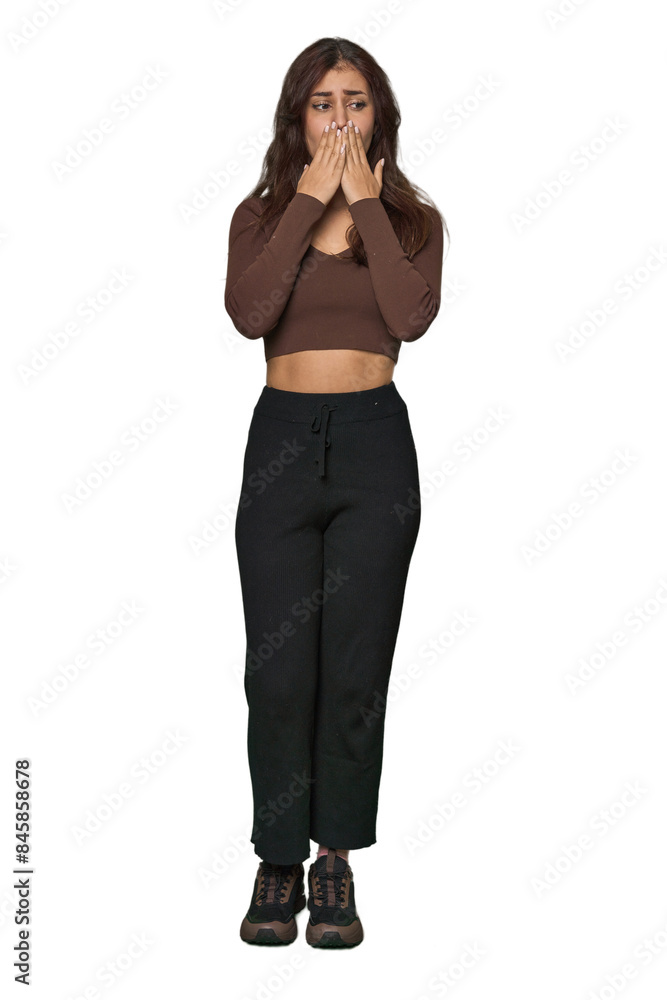 Middle Eastern woman, full body studio shocked, covering mouth with hands, anxious to discover something new. Middle Eastern woman, full body studio shocked, covering mouth with hands, anxious to discover something new.