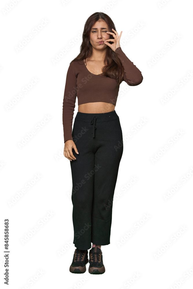 Middle Eastern woman, full body studio with fingers on lips keeping a secret. Middle Eastern woman, full body studio with fingers on lips keeping a secret.