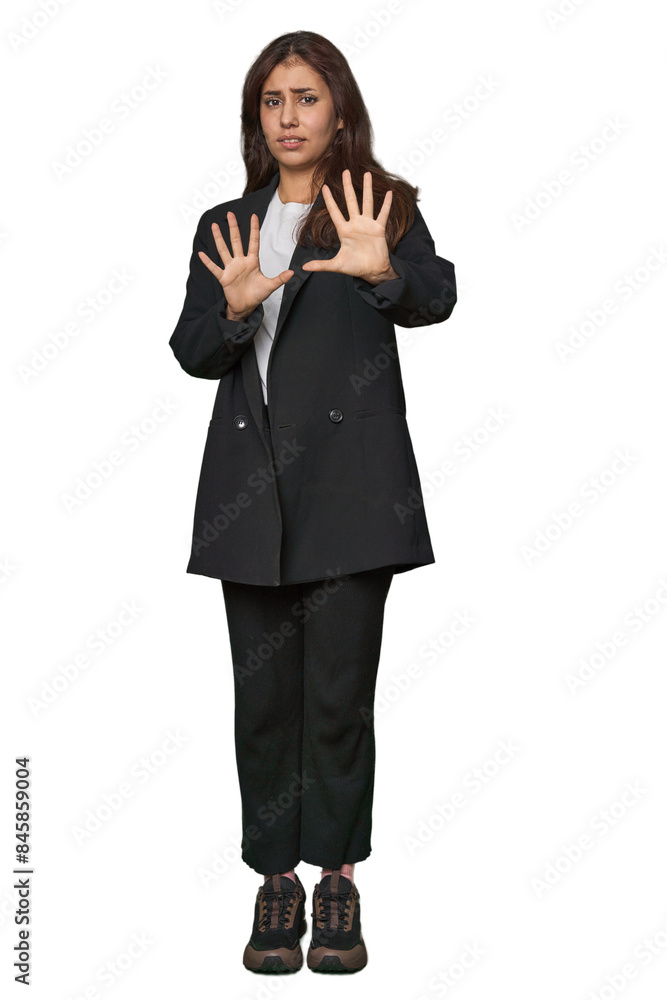 Middle Eastern in business attire rejecting someone showing a gesture of disgust.