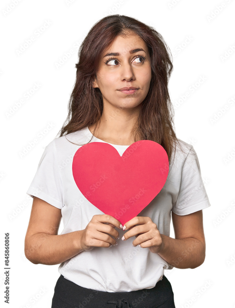 Young Middle Eastern woman holding paper heart, love concept Young Middle Eastern woman holding paper heart, love concept