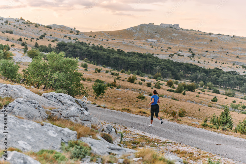 Empowered Runner Embracing Nature's Beauty on a Serene Morning Trail. Empowered Runner Embracing Nature's Beauty on a Serene Morning Trail.