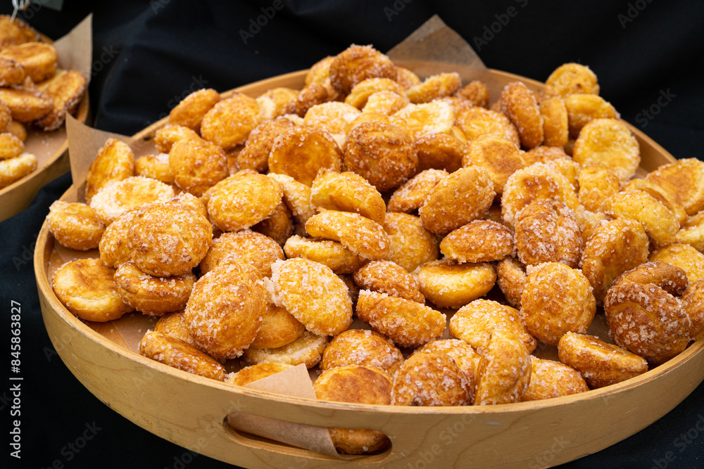 Puff pastries, round sugar-coated sugar puffs, golden crispy baked sweets, traditional French patisserie Puff pastries, round sugar-coated sugar puffs, golden crispy baked sweets, traditional French patisserie