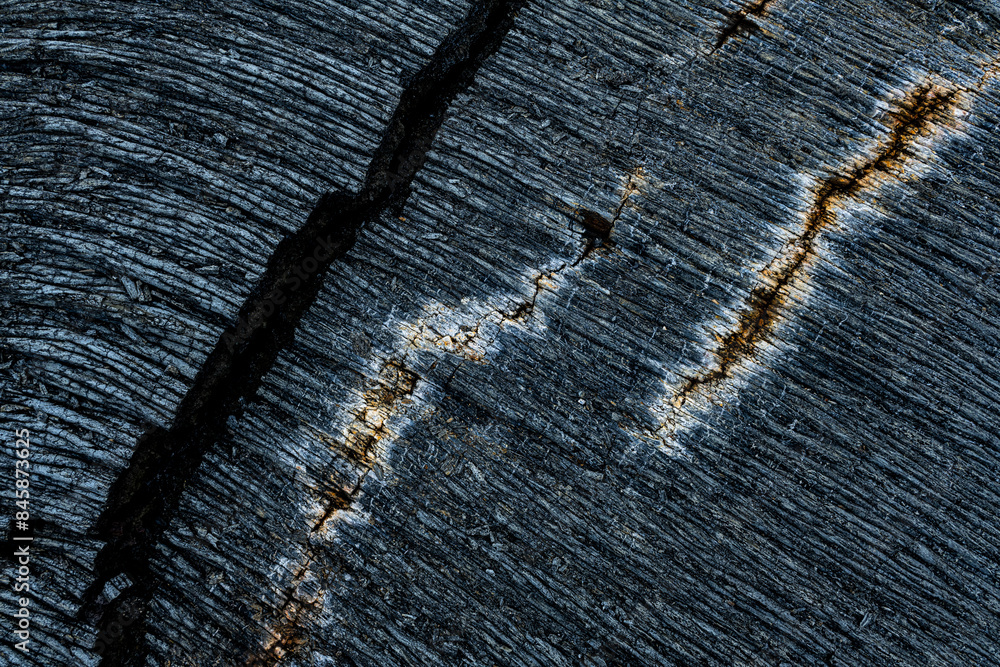 Fototapeta premium Dry cracked surface of cooled lava flow in desert