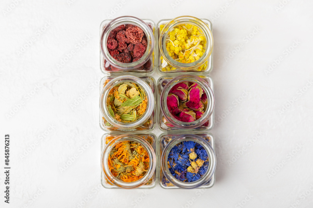 Assortment of dry herbal and berry tea on a wooden background. Tea party concept. medicinal herbs. Healing herbs.Alternative medicine.Linden, calendula, cornflowers, marigold, tansy, tea rose. Assortment of dry herbal and berry tea on a wooden background. Tea party concept. medicinal herbs. Healing herbs.Alternative medicine.Linden, calendula, cornflowers, marigold, tansy, tea rose.