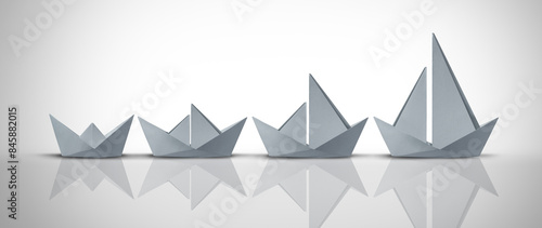 Business Development Concept and growth strategy or corporate model innovation as a motivational metaphor for growing success from simple to complex as origami boats. photo