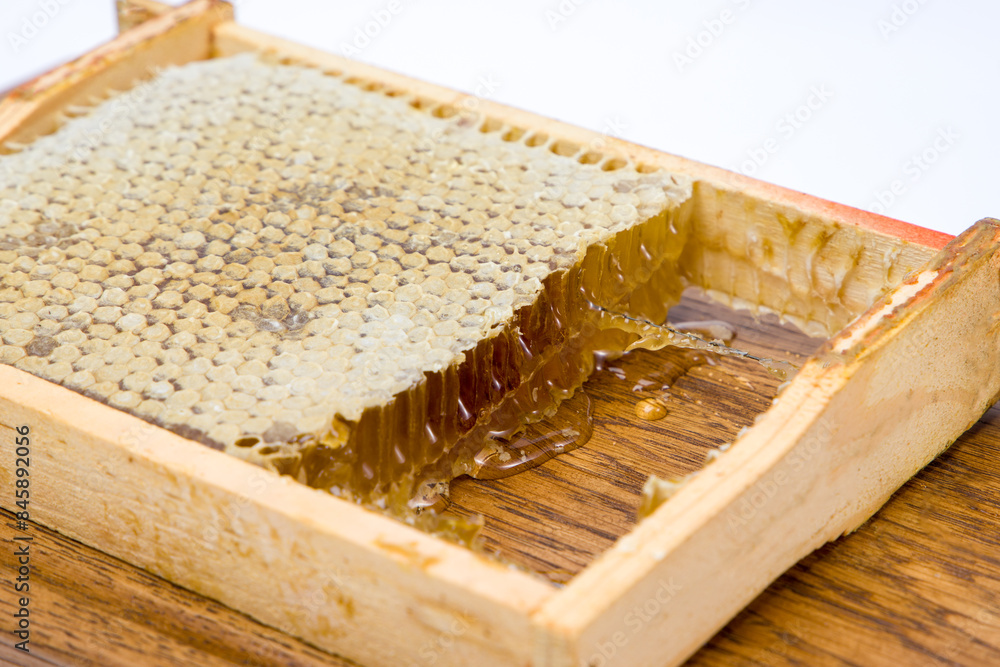 honeycomb with honey on a wooden background. honeycomb with honey on a wooden background.