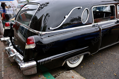 Bild auf Leinwand tail fin detail on an old black hearse