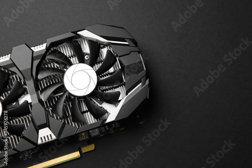 Computer graphics card on black background, top view. Space for text