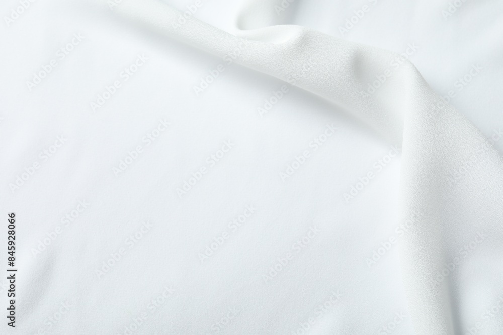 Fototapeta premium Texture of white fabric as background, top view