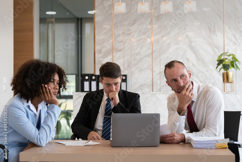 Tablou pe pânză Diverse business team contemplating at office desk, Concept of strategic decisio