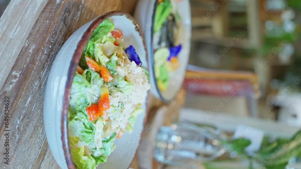 Two bowls of salad displayed beautifully on wooden dishware Two bowls of salad displayed beautifully on wooden dishware