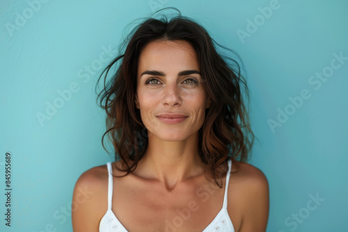 A close up portrait of a woman with a subtle smile