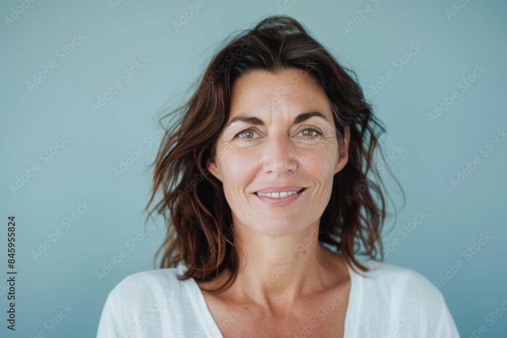 A close up portrait of a woman with a subtle smile A close up portrait of a woman with a subtle smile