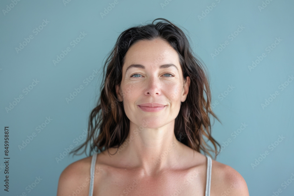 A close up portrait of a woman with a subtle smile A close up portrait of a woman with a subtle smile