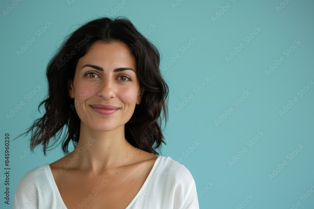 A close up portrait of a woman with a subtle smile A close up portrait of a woman with a subtle smile