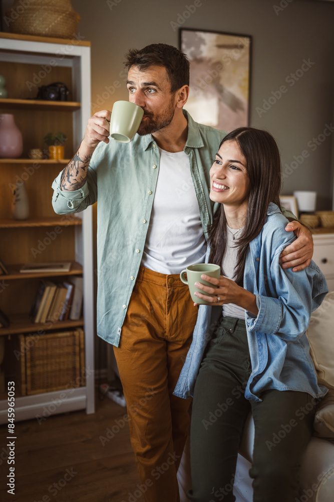 Boyfriend and girlfriend drink coffee and enjoy at home Boyfriend and girlfriend drink coffee and enjoy at home