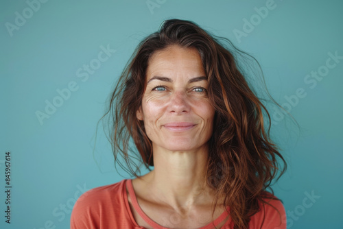 A close up portrait of a woman with a subtle smile