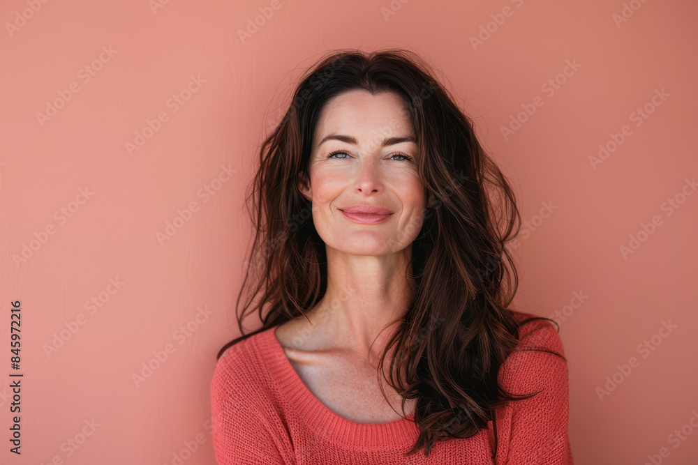 A close up portrait of a woman with a subtle smile A close up portrait of a woman with a subtle smile