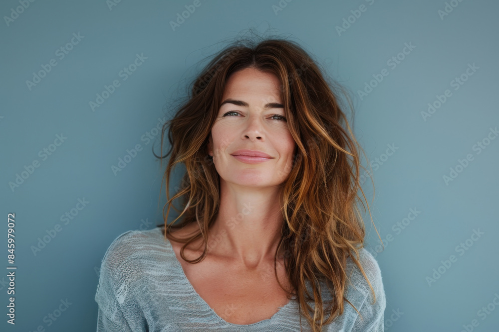 A close up portrait of a woman with a subtle smile A close up portrait of a woman with a subtle smile