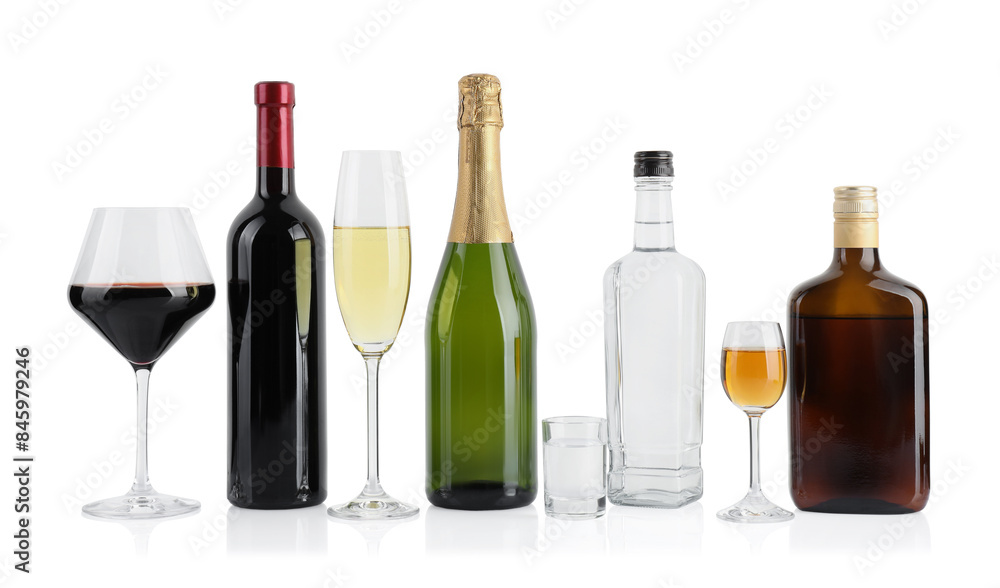 Bottles and glasses with different alcoholic drinks isolated on white Bottles and glasses with different alcoholic drinks isolated on white