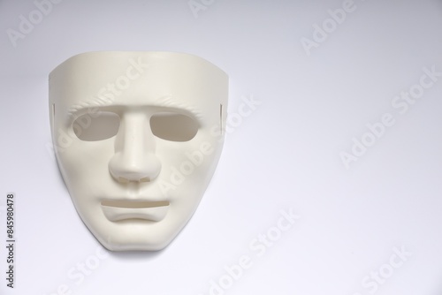Theater arts. Plastic mask on white background, top view. Space for text
