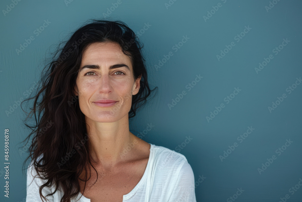 A close up portrait of a woman with a subtle smile A close up portrait of a woman with a subtle smile
