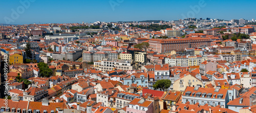 Panoramic view of Lisbon cityscape, budlings with red roofs in Portugal, during sunny day.