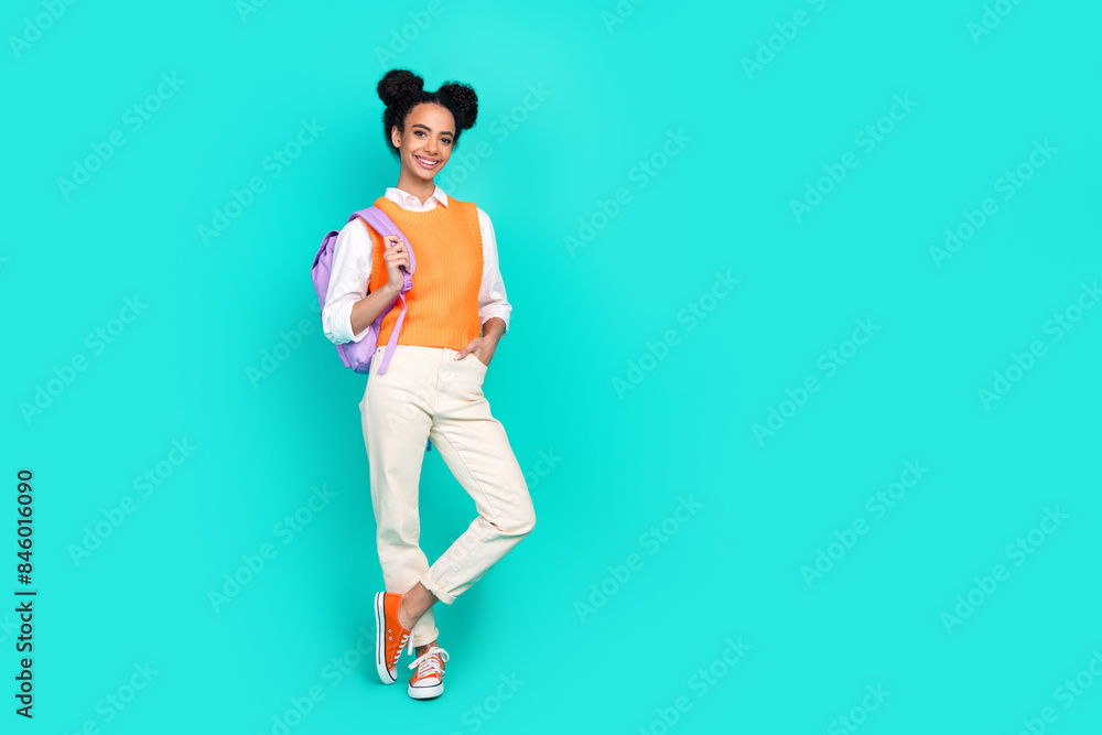 Full body portrait of nice young girl rucksack empty space wear vest isolated on turquoise color background Full body portrait of nice young girl rucksack empty space wear vest isolated on turquoise color background