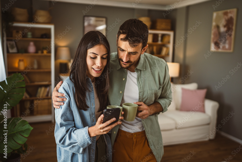 Couple use mobile phone for text message or browse internet at home Couple use mobile phone for text message or browse internet at home