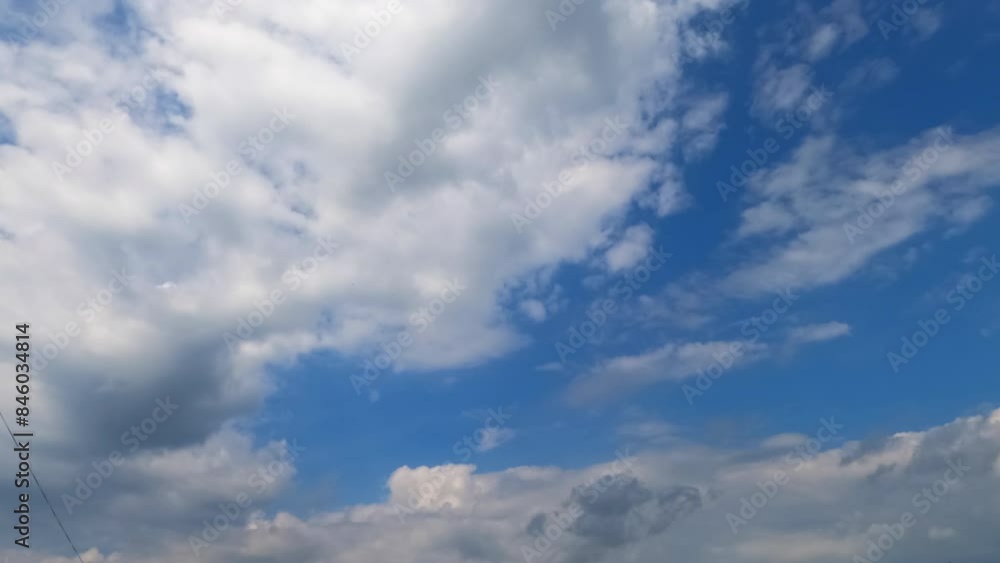 Accumulation of clouds in the blue sky. Separate white clouds transform into grey dark cloudscape. Low angle view. Timelapse. Accumulation of clouds in the blue sky. Separate white clouds transform into grey dark cloudscape. Low angle view. Timelapse.