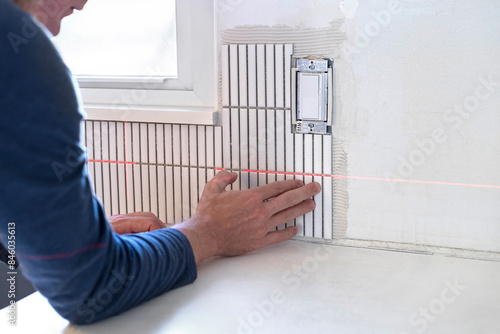 Fényképezés Tile backsplash installation
