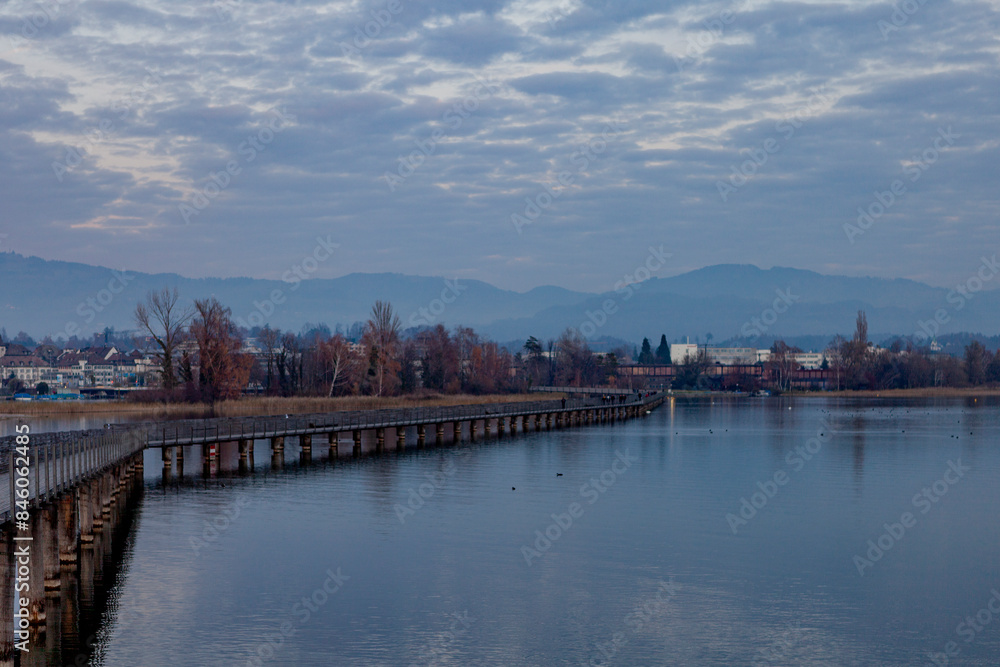Holzbrücke Rapperswil-Hurden Bridge crossing Lake Obersee in Switzerland. Holzbrücke Rapperswil-Hurden Bridge crossing Lake Obersee in Switzerland.