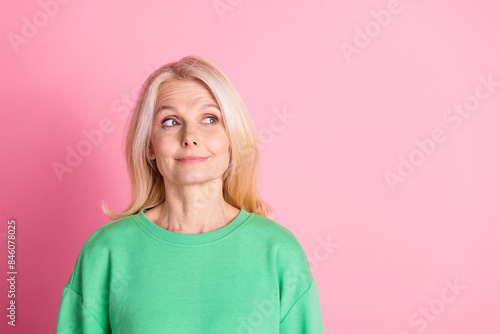 Photo portrait of lovely senior lady look empty space dressed stylish green garment isolated on pink color background