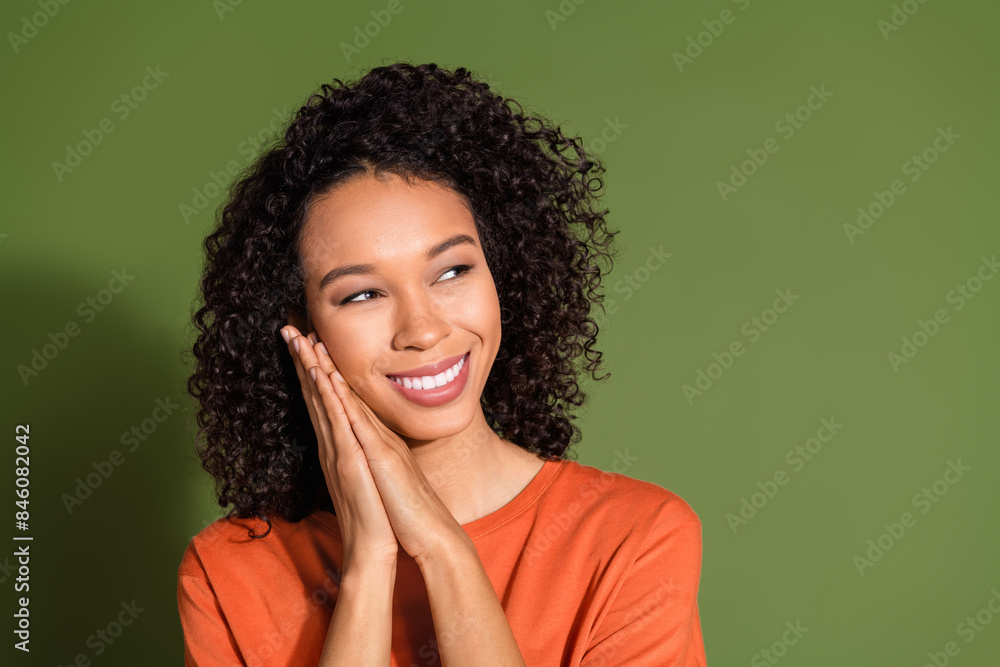Photo portrait of attractive young woman sleepy look empty space dressed stylish orange clothes isolated on khaki color background Photo portrait of attractive young woman sleepy look empty space dressed stylish orange clothes isolated on khaki color background