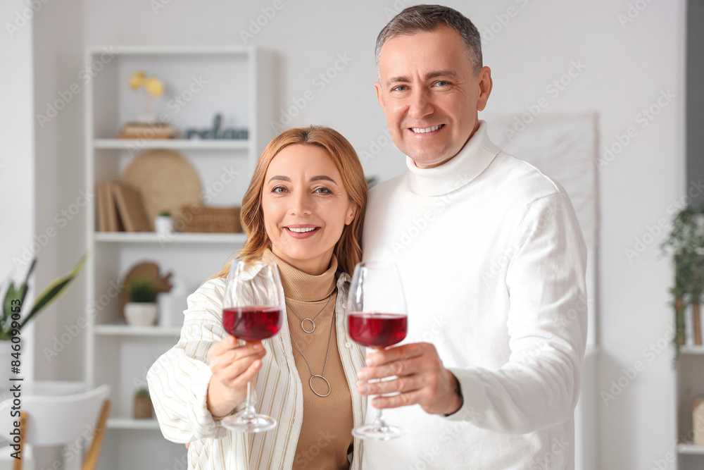 Mature couple with glasses of wine at home Mature couple with glasses of wine at home