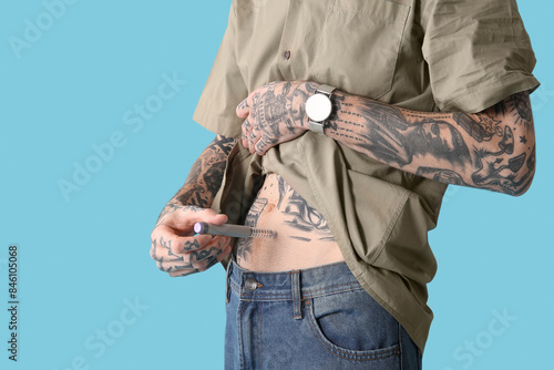 Diabetic young man using la...