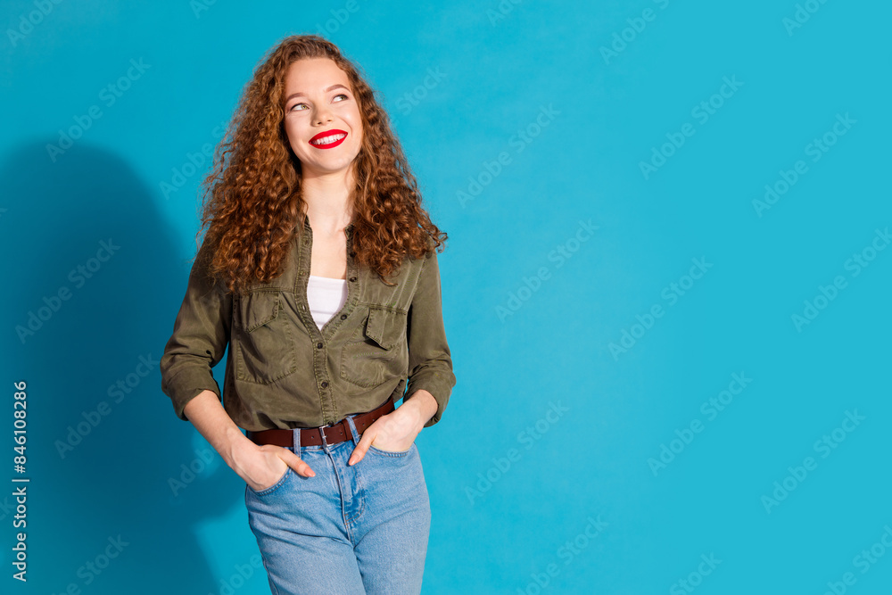 Portrait of pretty young woman look empty space wear khaki shirt isolated on turquoise color background Portrait of pretty young woman look empty space wear khaki shirt isolated on turquoise color background