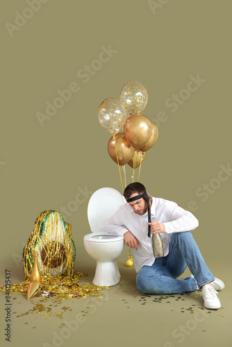 Young man with hangover and...