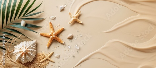 Top view of sandy beach summer vacation background with starfish on beige surface, providing copy space and a flat lay composition, ideal for banners