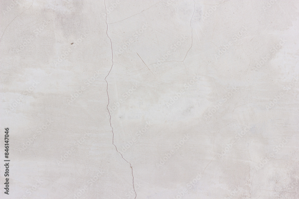 Fototapeta premium Grey cracked wall background.