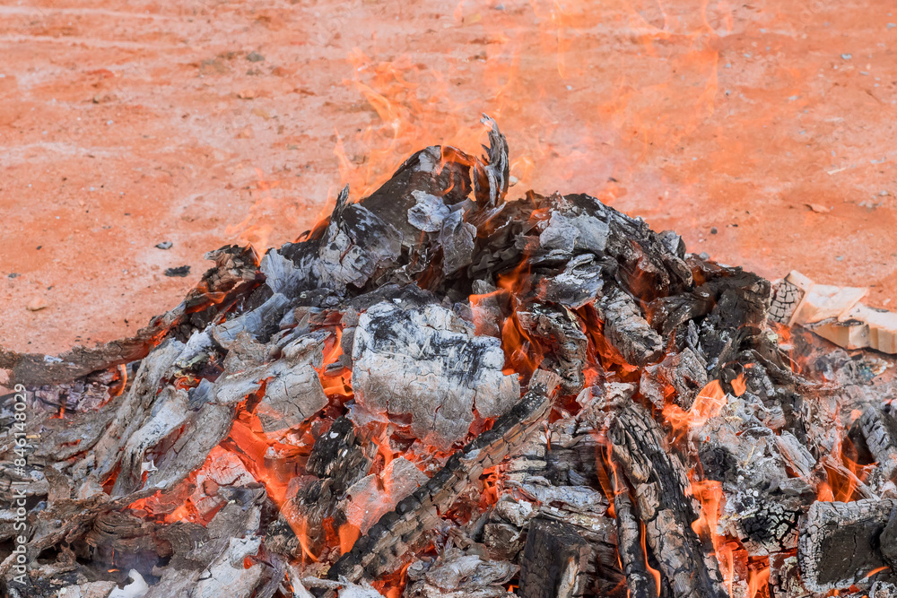 Flames of fire burning on wood are viewed close up Flames of fire burning on wood are viewed close up
