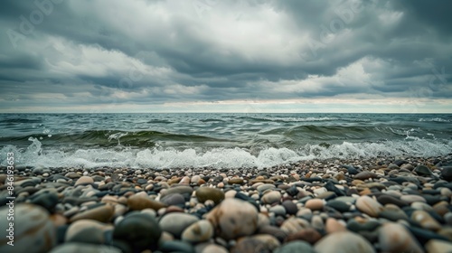 Afternoon view of sandy shore under cloudy skies from a low angle