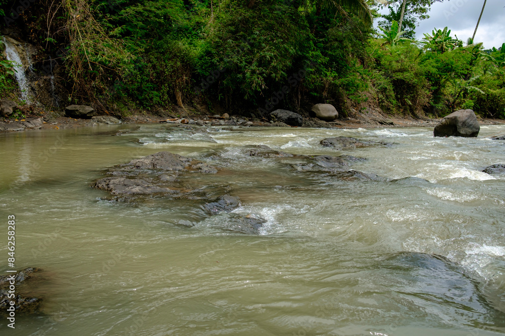 the calm flow of river water in a village the calm flow of river water in a village
