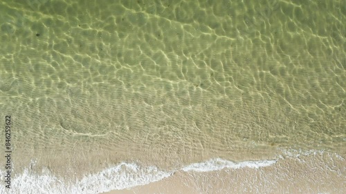 Crystal Clear Ocean Water With Waves Running Ashore In Dennis Port, Nantucket Sound, Massachusetts. aerial topdown shot