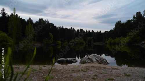 Shot of revealing Pinders Pond near town of Roxburgh in New Zealand during evening. photo