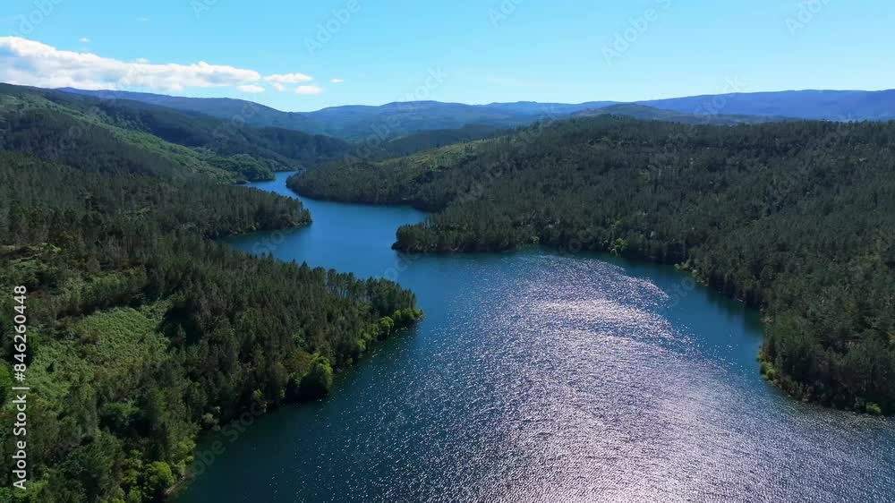 Scenic Landscape Of Rio Avia River And Forested Mountains In Ribadavia, Ourense Province, Galicia, Spain. Aerial Shot Scenic Landscape Of Rio Avia River And Forested Mountains In Ribadavia, Ourense Province, Galicia, Spain. Aerial Shot