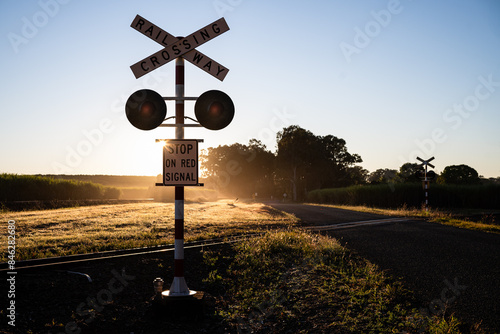 Cane train rail railway crossing, rural Queensland Australia, early morning sunrise dawn, sugarcane farming agriculture
