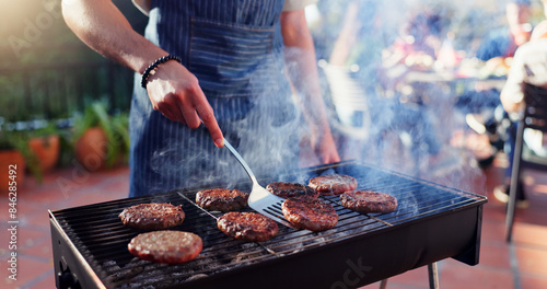 Tableau sur toile Barbecue, cooking and man with burgers outdoor backyard for meal at reunion, social event or lunch on terrace
