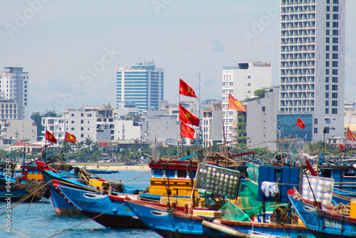 Photography capturing the traditional Vietnamese boats, showcasing their unique designs and the serene beauty of Vietnam's waterways. Perfect for highlighting cultural heritage and maritime life in Vi