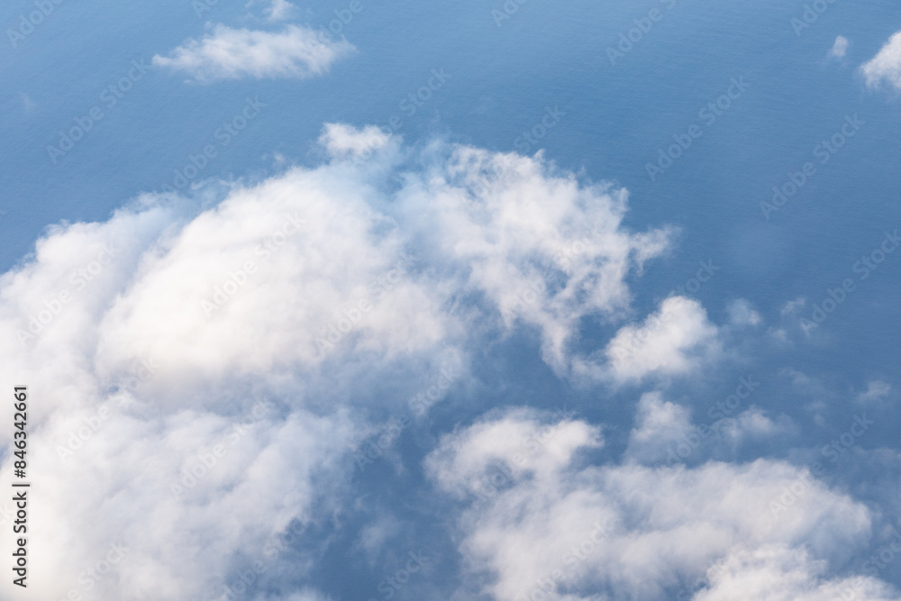Clouds photographed from an airplane,Cumulus clouds are clouds that have flat bases and are often described as puffy, cotton-like, or fluffy in appearance. Honolulu to Lihue Clouds photographed from an airplane,Cumulus clouds are clouds that have flat bases and are often described as puffy, cotton-like, or fluffy in appearance. Honolulu to Lihue